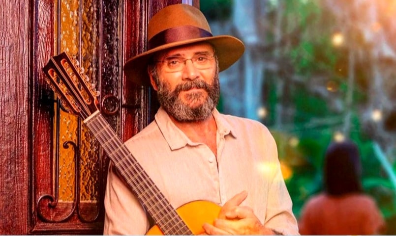 Imagem de cantor com viol&atilde;o.